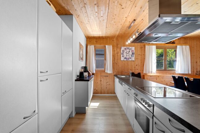 Modern white fitted kitchen inside the chalet